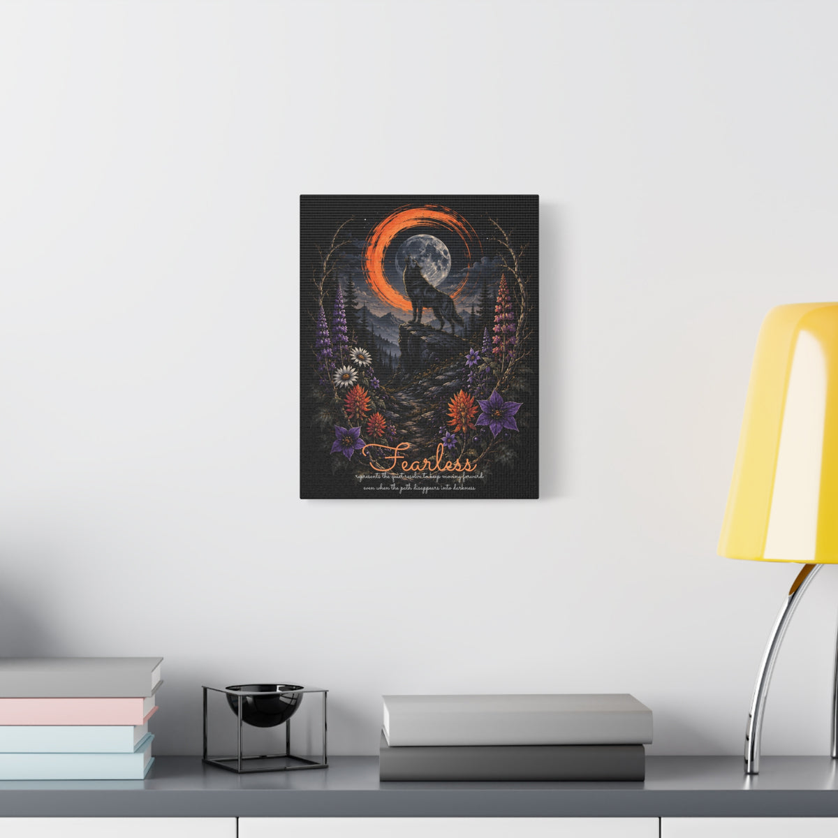 Fearless wolf and wildflowers canvas displayed on a white wall above a console and lamp