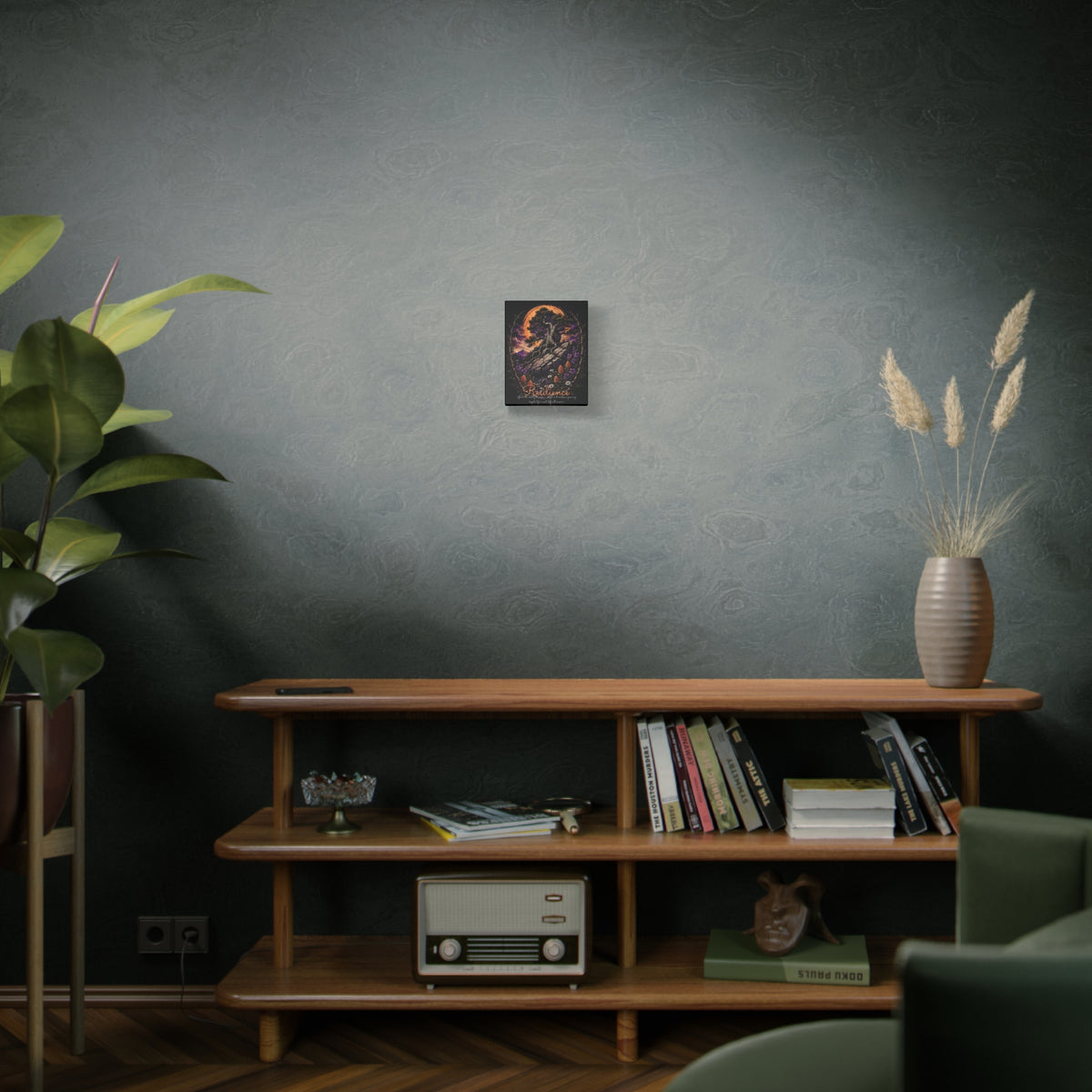 Resilience tree and wildflowers canvas displayed on a gray-green wall above a wooden cabinet
