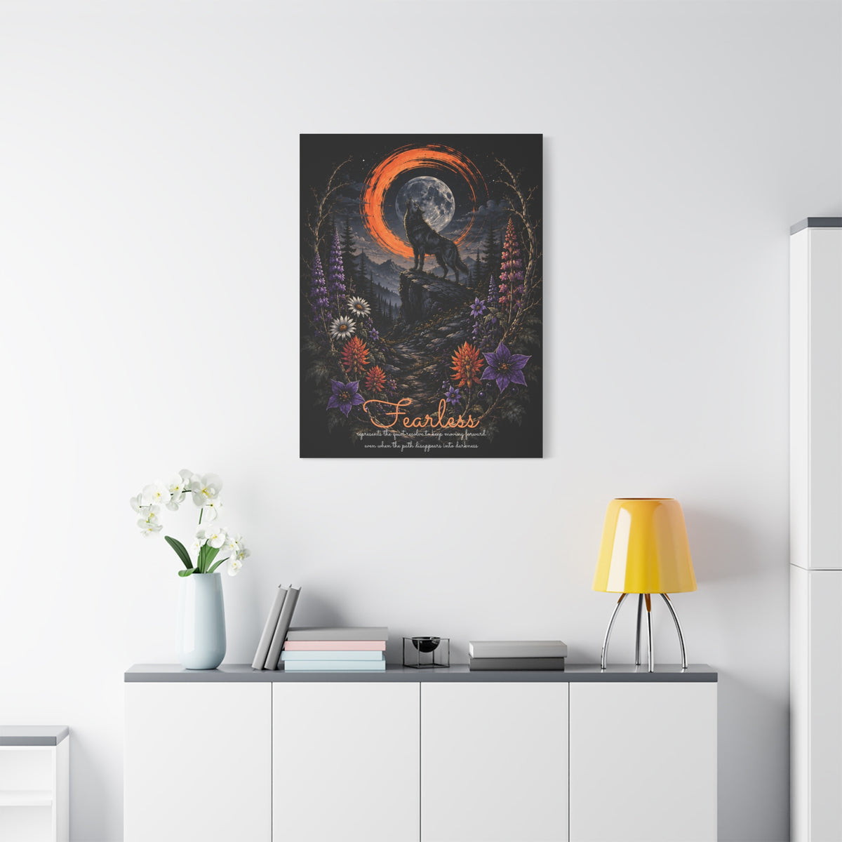 Fearless wolf and wildflowers canvas displayed on a white wall above a console and lamp